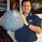 Eric Vandernoot with a paper-mache' model of the asteroid Vesta.