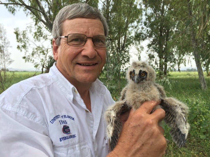 Dr. Richard Raid and juvenile barn owl