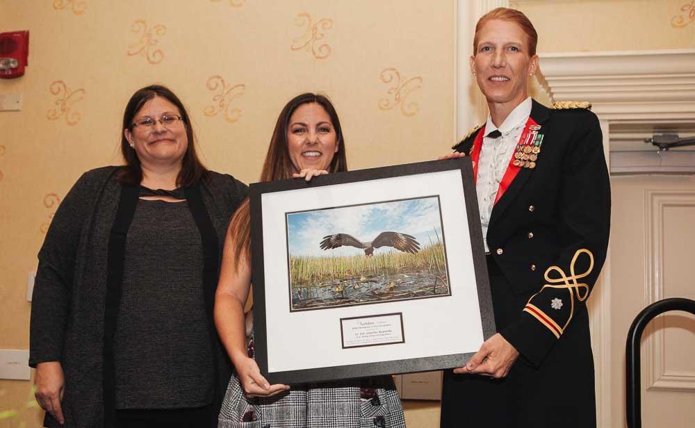 Lt. Col. Jennifer Reynolds (U.S. Army) being recognized as the 2018 Champion of the Everglades. Pictured with Audubon Florida Executive Director Julie Wraithmell (left) and Director of Everglades Policy Celeste De Palma (right). Photo credit: Jayme Gershen