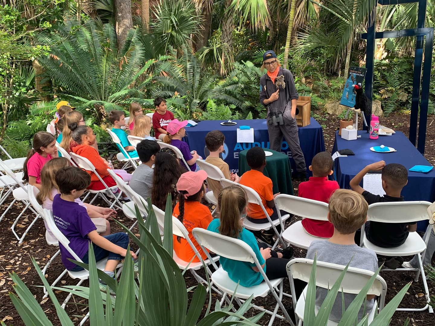 Children listening to an Audubon Everglades education program in a garden